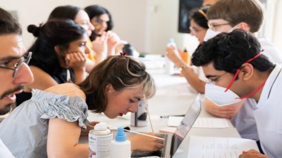 Students studying around a table at Anhalt University