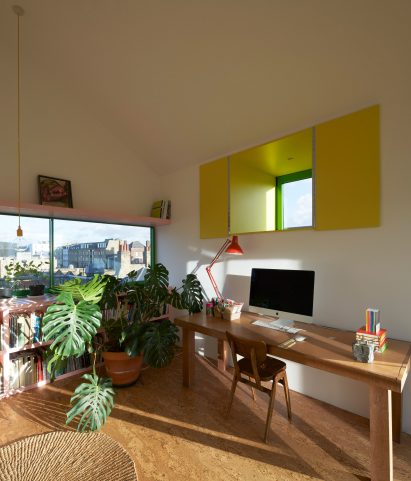 Roof top studio with pink shelving