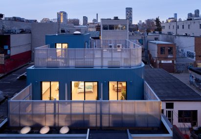 Corrugated metal facade on extension by Firma