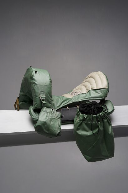 A vintage raincoat repurposed with hanging bags