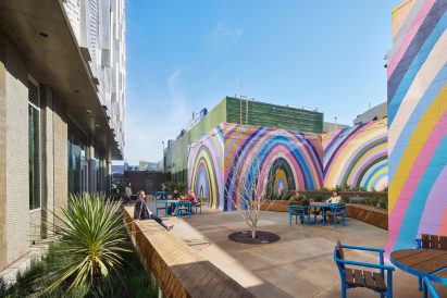 Rainbow mural-lined courtyard in social housing block