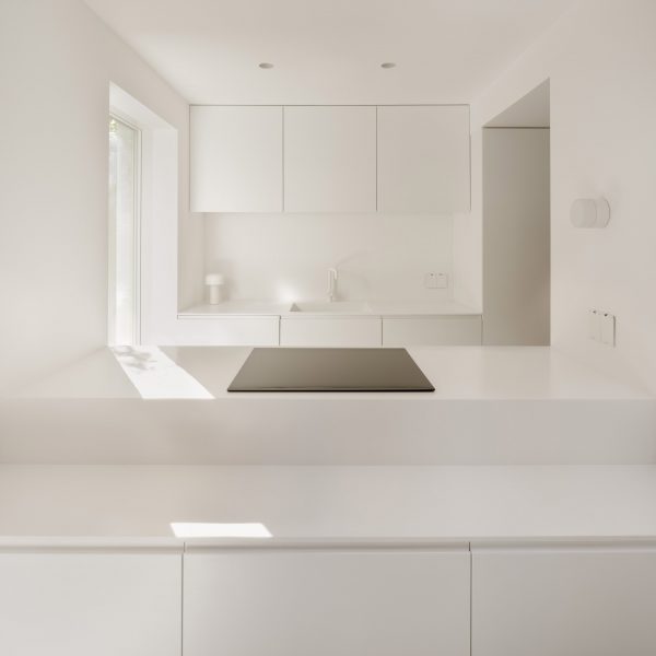 Minimalist white kitchen of London house