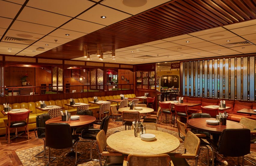 Yellow banquette seating in Dishoom Canary Wharf