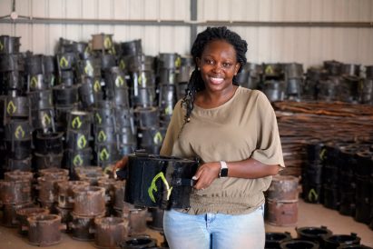 Woman holding Mukuru Clean Stoves