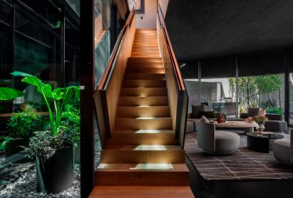 Wooden staircase in concrete home