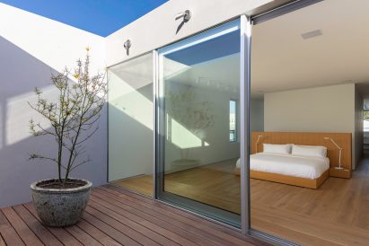 Two-bedroom unit in white stucco house