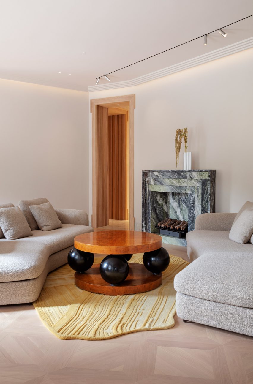 Wooden floors in living room with sculptural wooden table