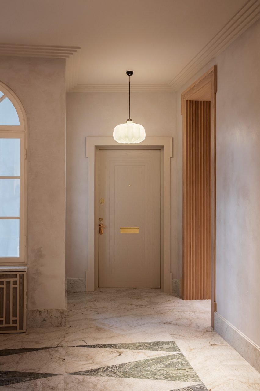 Hallway with marble floor outside Stockholm flat