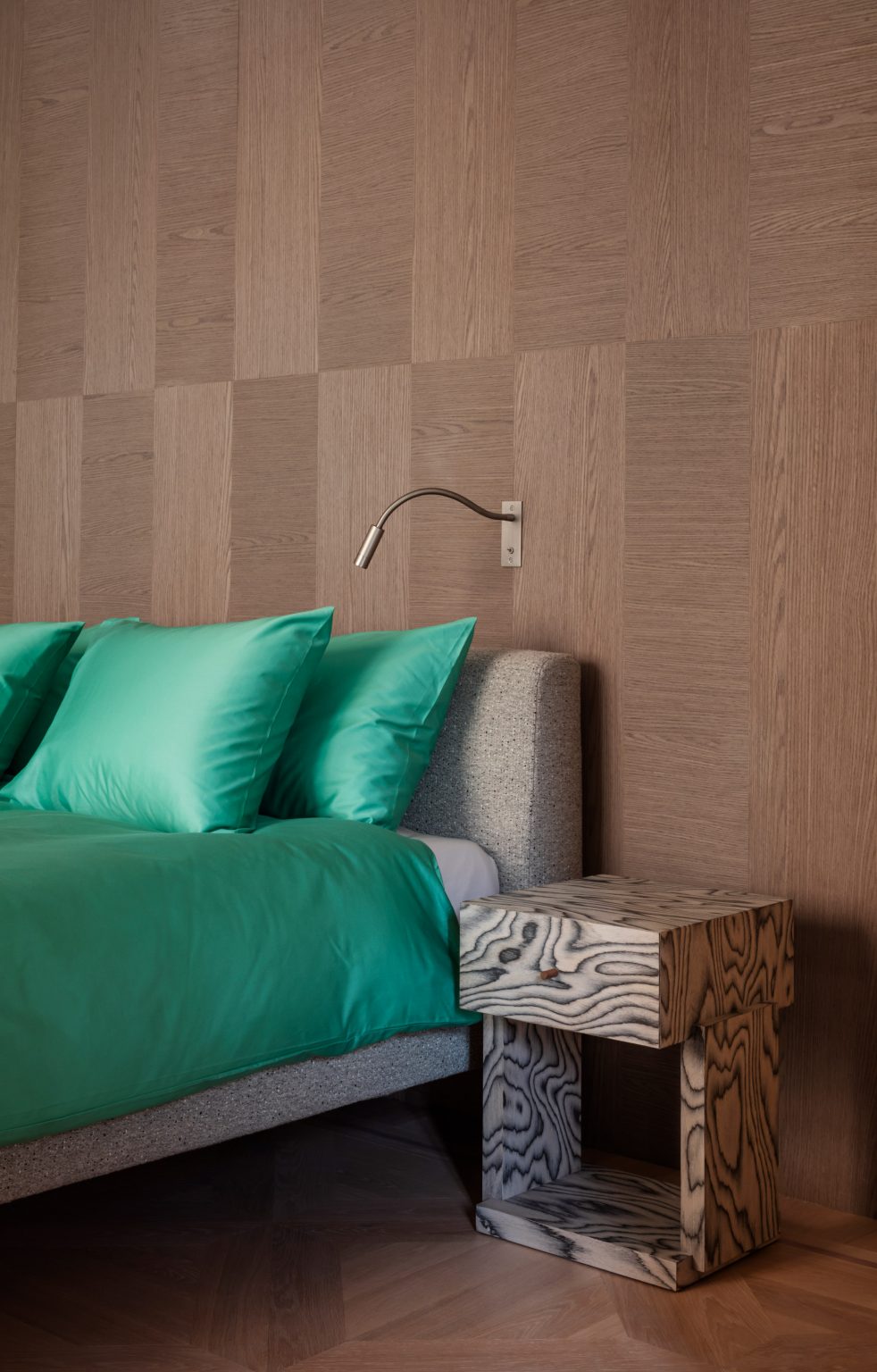 Bedroom with patterned wooden bedside table