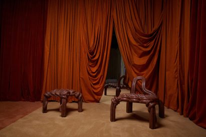 Red rope-like furniture pieces made from stone