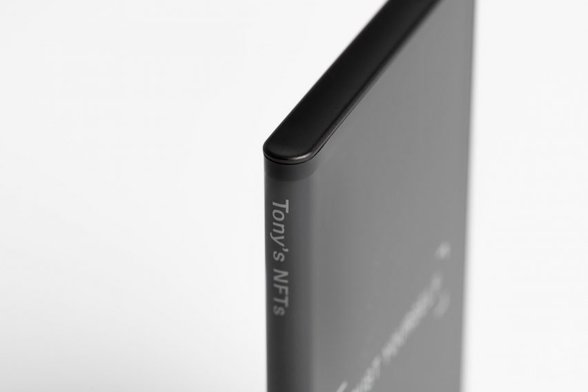 Close-up on spine of Ledger Stax device showing text reading "Tony's NFTs"