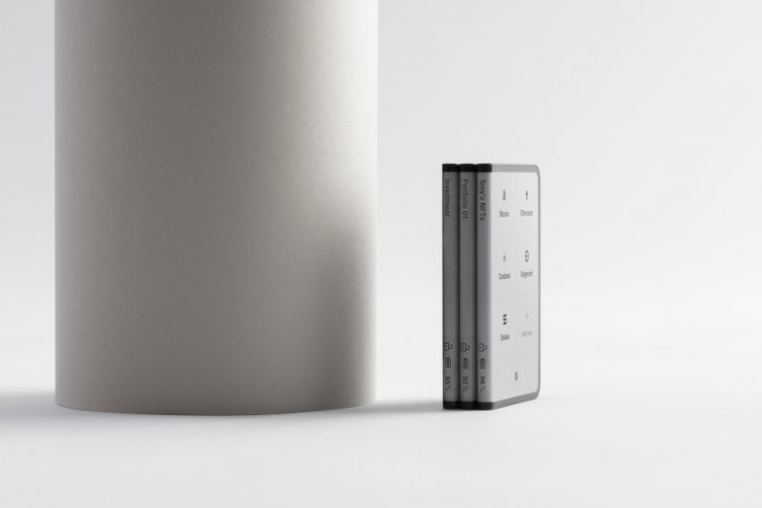Three Ledger Stax devices stacked upright like ledgers