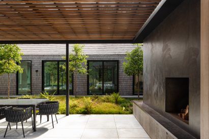 Fireplace in Hamptons house by Oza Sabbeth Architects