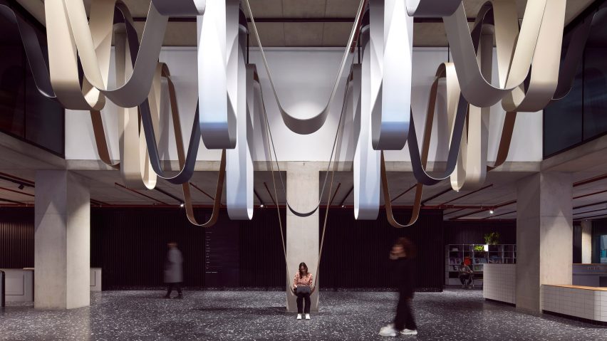 Installation of loop-shaped metallic artwork