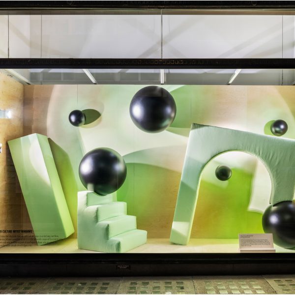 Green shop window with steps, arches and spheres