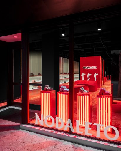 Store window with illuminated display boxes