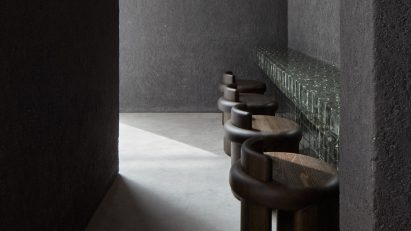 Row of stools in front of counter in Origami sushi restaurant in The Dubai Mall by VSHD Design