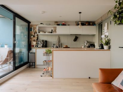 White kitchen with green tiles