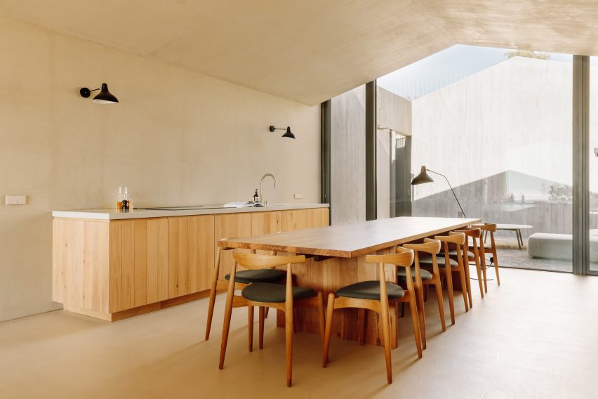 Dining table in Pateos houses by Manuel Aires Mateus