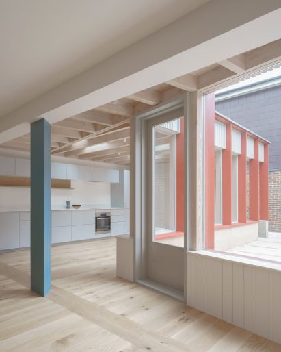 Interior with wooden floors and triangular blue pillar