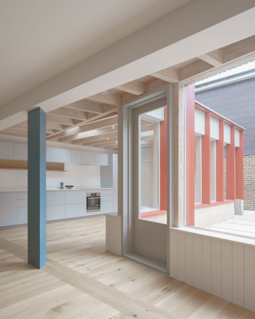 Interior with wooden floors and triangular blue pillar