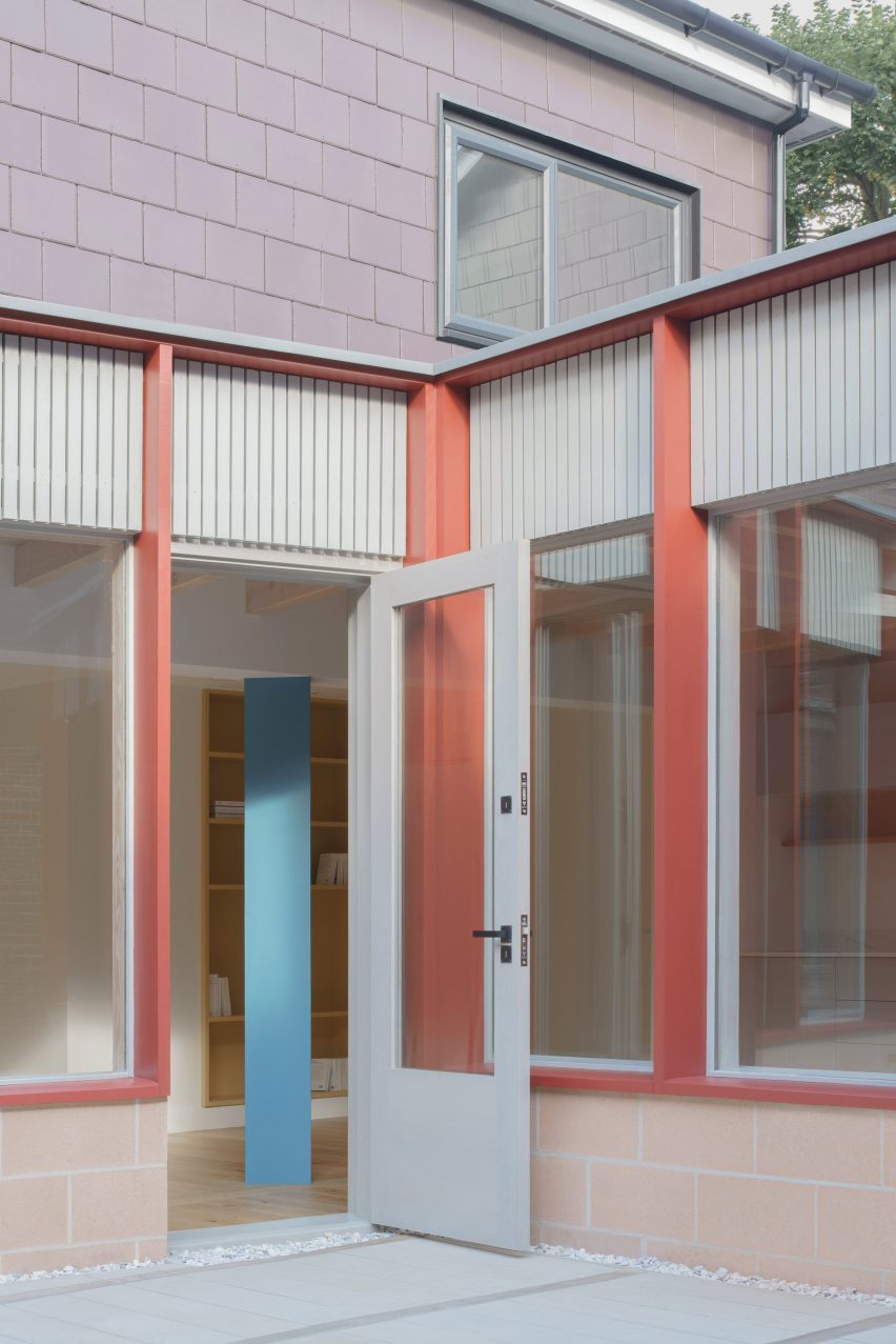 Pale-pink concrete blockwork with cloister-like facade