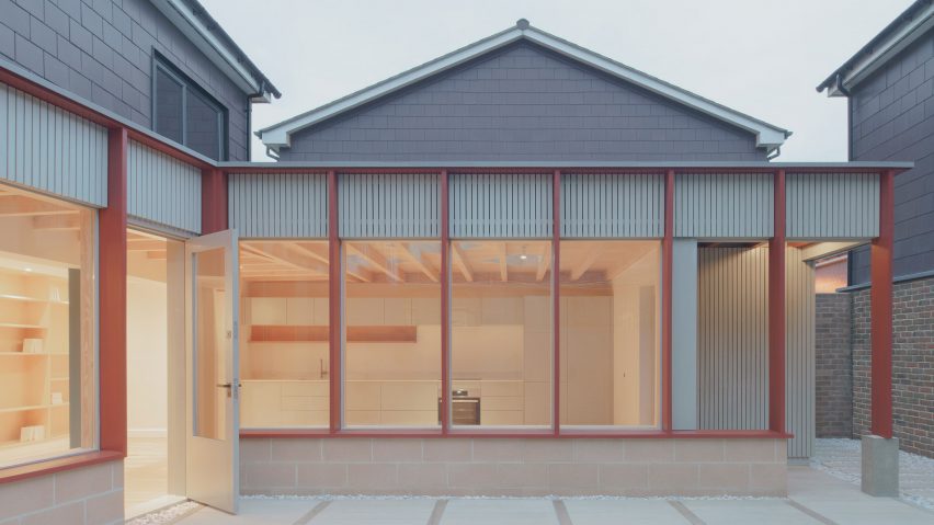 Extension with red timber pillars