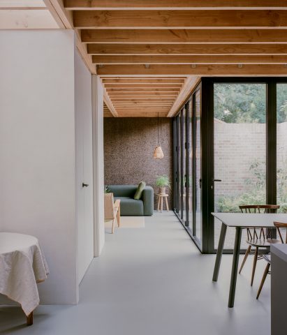 Interior image of open-plan living area with cork walls