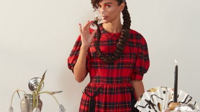 Portrait of designer Laila Gohar in chequered dress