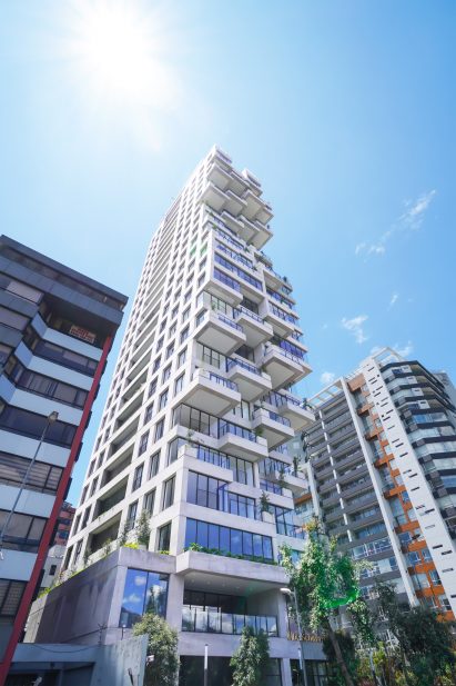 Exterior image of the protruding terraces across the facade of Qorner