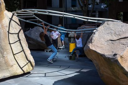 circular monkey bars at Mike Hewson's Rocks on Wheels playground sculpture in Melbourne
