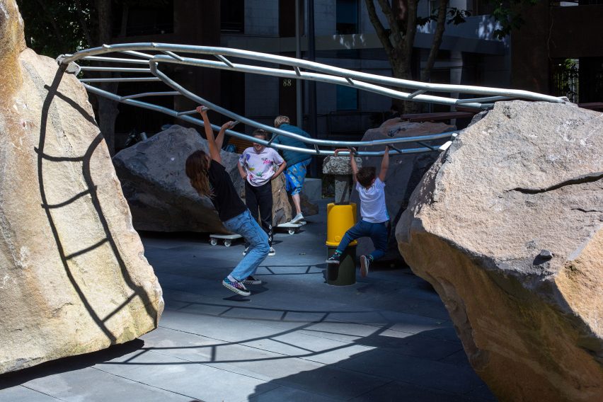 circular monkey bars at Mike Hewson's Rocks on Wheels playground sculpture in Melbourne