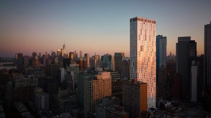 11 Hoyt skyscraper recflecting the sunset with downtown brooklyn in background
