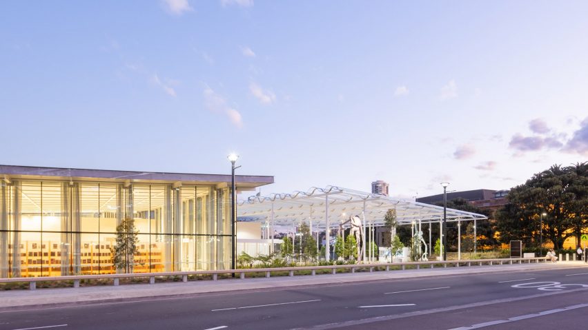Glass entrance pavilion of Sydney Modern under a clear sky at dusk