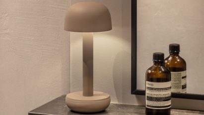 White lamp on marble mantelpiece