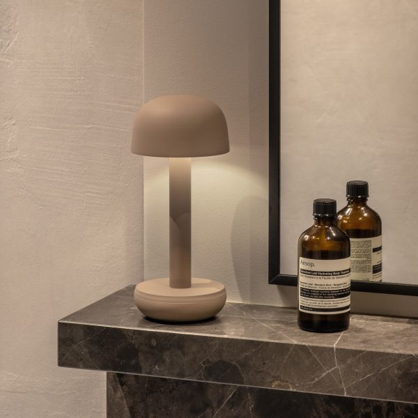 White lamp on marble mantelpiece