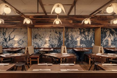 Wallpaper by Camille Warmington behind booths