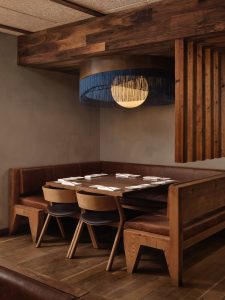 Chef's table below blue fringe light