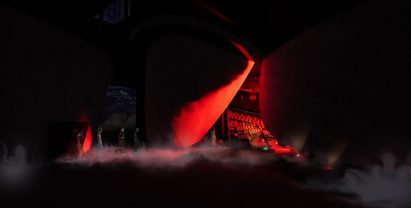 Visualisation showing dark backstage space with red lighting
