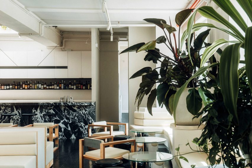 Lounge area with plants in foreground