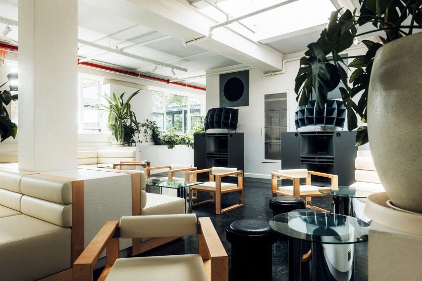 Chairs in front of large speaker cabinets