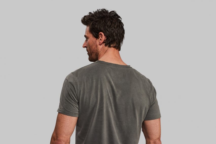 Rear view of person wearing black algae dye T-shirt by Vollebak and Living Ink