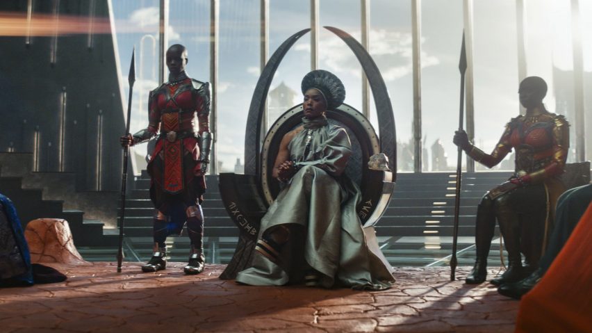 Queen Raymonda sitting in a throne next to her aides