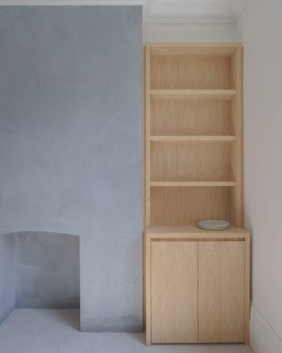 Micro-cement fireplace with wooden storage unit