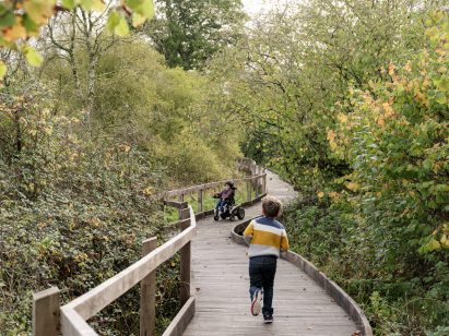 Children playing on boardwalk at Wraxall Yard 