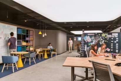 IE University's workspaces with students working on group projects