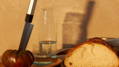 Photo of foot and kitchenware on a surface