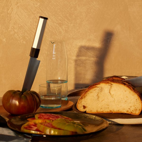 Photo of foot and kitchenware on a surface
