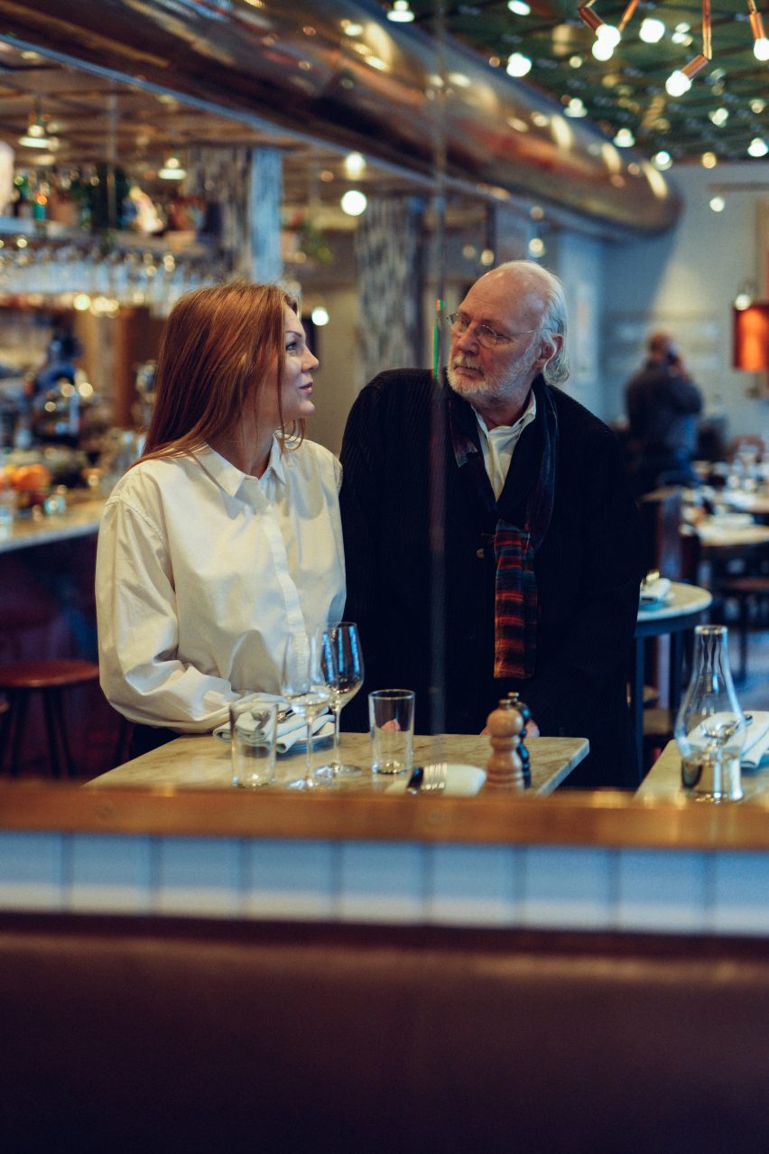 Photo of two people sat at a table