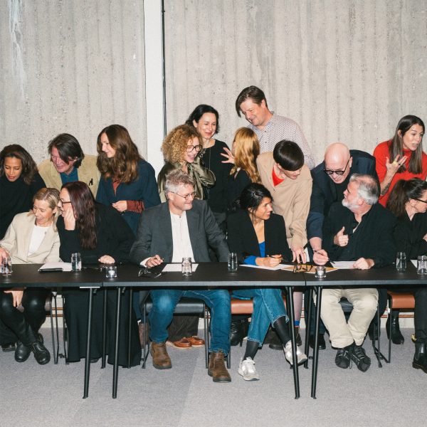 Image of group of people sat at a table